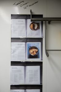 Asma Khan's recipes pinned to the wall in the College kitchen