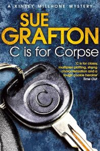 C is for Corpse book cover with a car key on a blue background