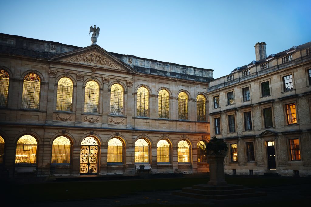 Back Quad at night time showing the lights in the library windows