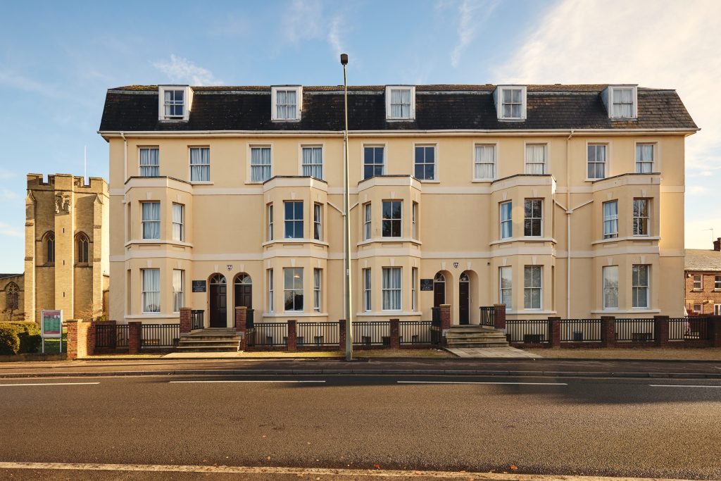 Cardo building exterior: a set of terraced four-storey houses taken from across the Iffley Road