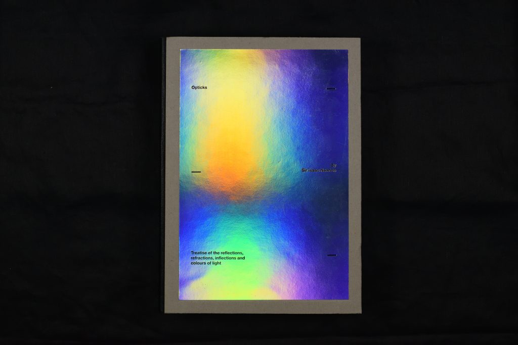 a holographic book cover of Newton, Isaac. Opticks: Treatise of the Reflections, Refractions, Inflections and Colours of Light. Edited by Laura Schröder, Printed and bound by SYL, 2018. The Queen’s College,QC353.NE.