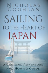 book cover for Sailing to the Heart of Japan with a background photo of the sea with a small sailing boat and Japanese style gateway between two islands