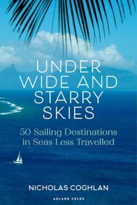 book cover for Under Wide and Starry Skies: 50 sailing destinations in seas less travelled by Nicholas Coghlan with text overlaid on a background of deep blue ocean and palm fronds hanging down from the top