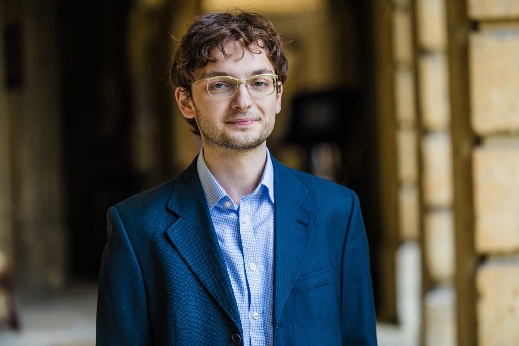 Jack Franco profile photo with the cloister in the background.